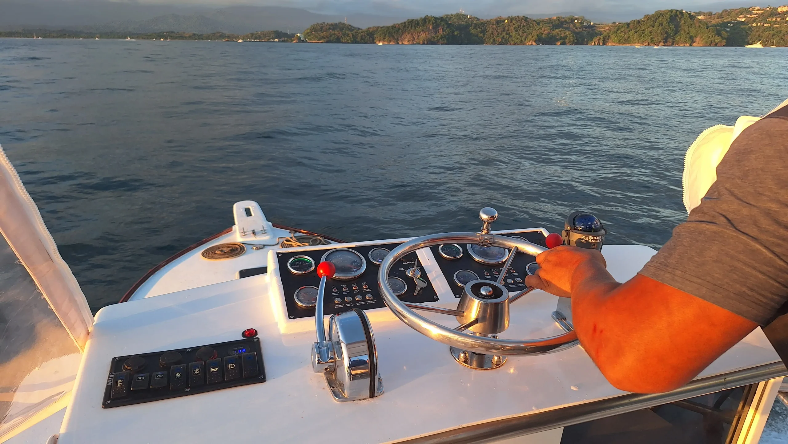 Captain steering the Manuel Antonio Fishing Charter boat
